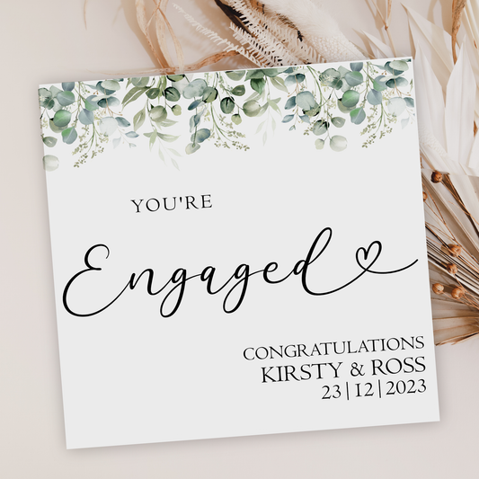 a card with the words engaged written on it