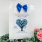 a wedding card with a blue tree and a blue bow