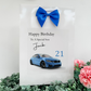 a birthday card with a blue car and a blue bow
