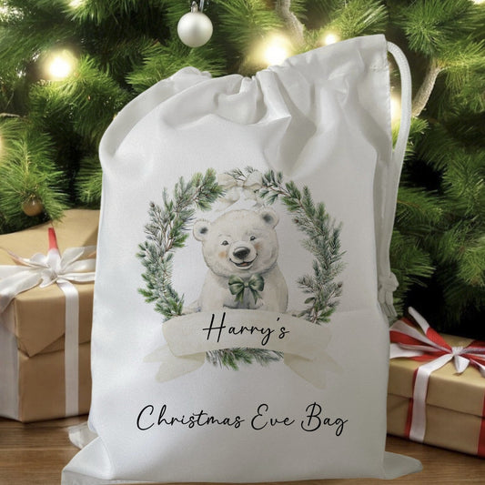 white drawstring personalised christmas eve treat bag for pjs, pyjamas, hot chocolate, treats and mug