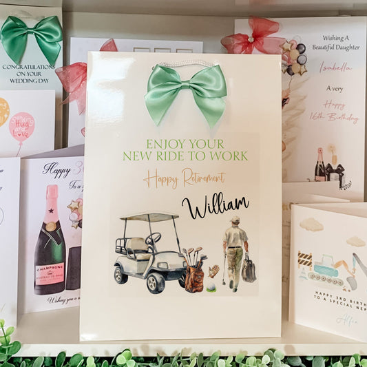 gift bag with a green bow, golf cart, and person walking with a bag, surrounded by other cards.