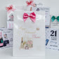 Collection of birthday and retirement cards with decorative ribbons on a white background