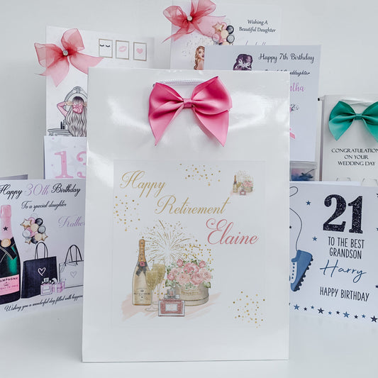 Collection of birthday and retirement cards with decorative ribbons on a white background