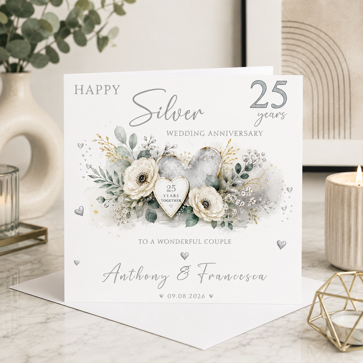 Personalised 25th Silver Wedding Anniversary card with silver hearts, white flowers, eucalyptus foliage and personalised couple names