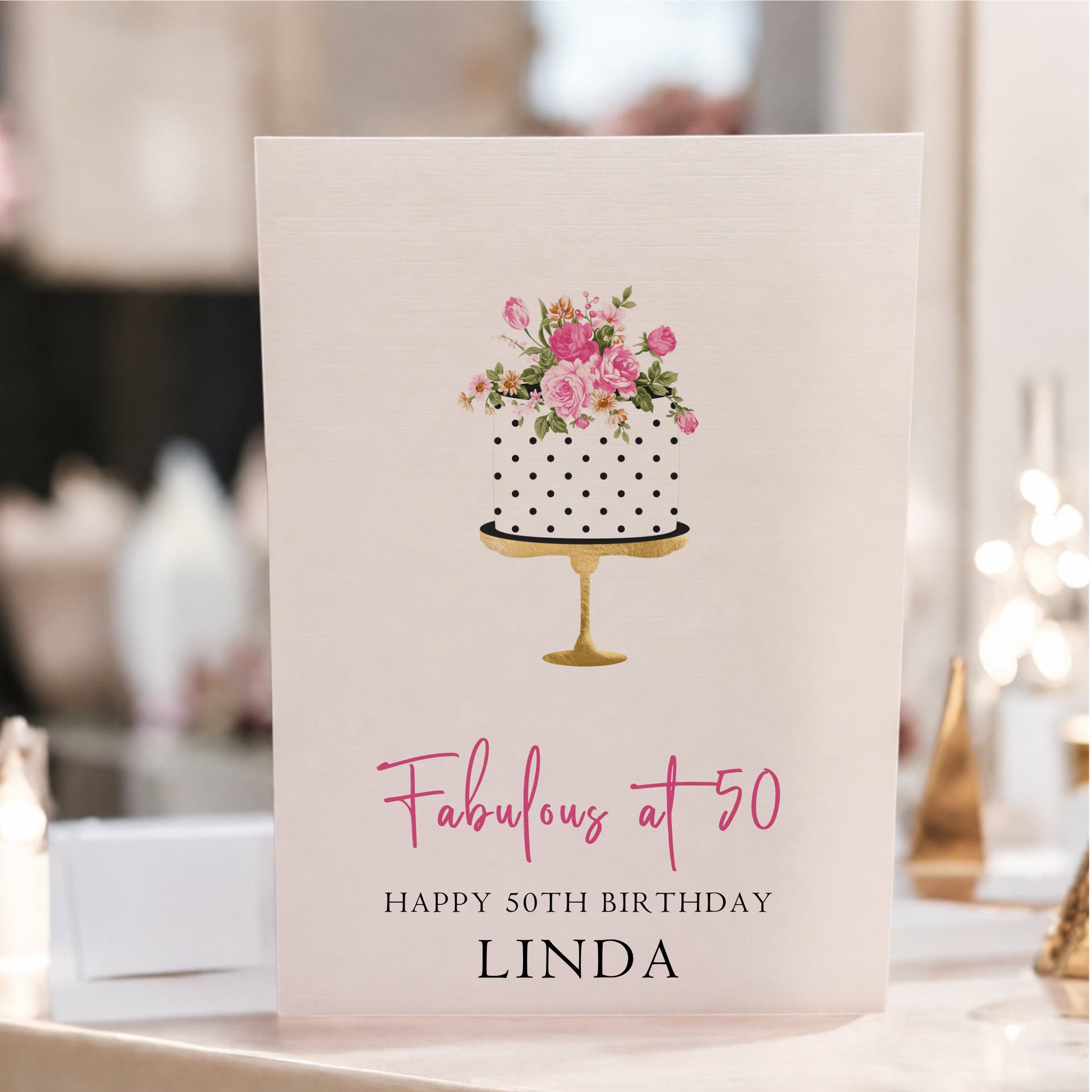 Personalised large A4 luxury 50th birthday card featuring a floral birthday cake on a gold stand, customised with any name and hand-finished with gorgeous sparkle.