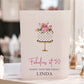 Personalised large A4 luxury 50th birthday card featuring a floral birthday cake on a gold stand, customised with any name and hand-finished with gorgeous sparkle.