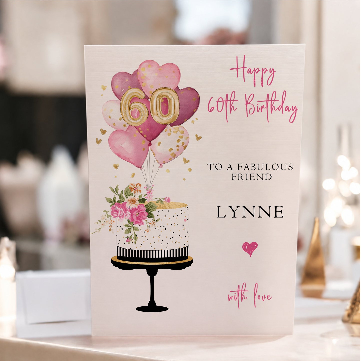 Personalised large A4 luxury 60th birthday card featuring a floral birthday cake, pink and gold heart balloons, gold number balloons, customised with any name and hand-finished with gorgeous sparkle.