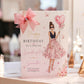 A personalized 30th birthday card for a grand-daughter, styled with a large pink satin bow on a white table runner. The card features an illustration of a woman in a pink floral dress holding a heart-shaped balloon with '30' on it, set against a softly blurred festive background.