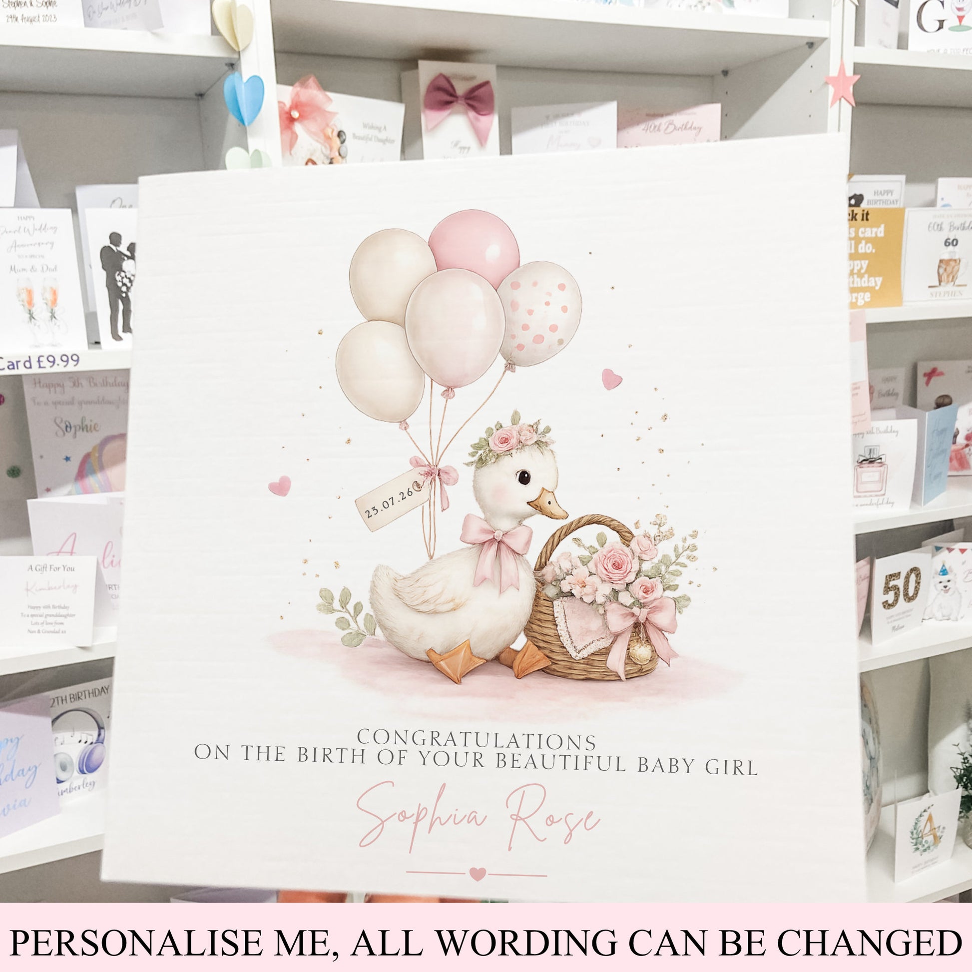 new baby congratulations card featuring an illustration of a duckling with balloons, a basket of flowers, and a heart-shaped bow. The text reads 'Congratulations on the birth of your beautiful baby girl Sophia Rose'.