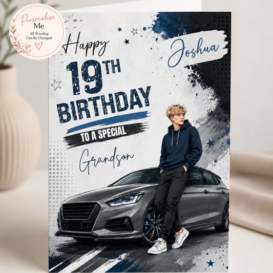A personalized 19th birthday card for a grandson, featuring a photo of a man in a navy hoodie leaning on a dark gray car. The card has a white, navy, and black design with the text 'Happy 19th Birthday to a Special Grandson' and the name 'Joshua'.