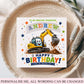 A personalized birthday card for a grandson, featuring a cartoon yellow excavator digging up dirt, with the text 'TO AN AMAZING GRANDSON ANDREW HAPPY BIRTHDAY! HAVE AN AMAZING DAY!'. The card is displayed on a woven straw hat with a pink fabric background.