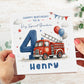 A personalized birthday card for a grandson, held by two hands. The card features a red fire truck, a large blue number 4, balloons, and the text 'HAPPY BIRTHDAY TO A Very Special Grandson' and 'Henry'.