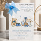 A white new baby boy greeting card displayed upright in a softly styled neutral setting. The card features a teddy bear wearing a blue bow, tiny blue baby shoes, a woven basket containing baby clothing and a blue and white blanket, surrounded by small stars and delicate botanical details. The card reads “Congratulations Stuart & Lynne” and “On the Birth of Your Special Son”, with “Carter Sam Harper”, “Welcome to the World Little One” and the date “15th August 2026” displayed below.