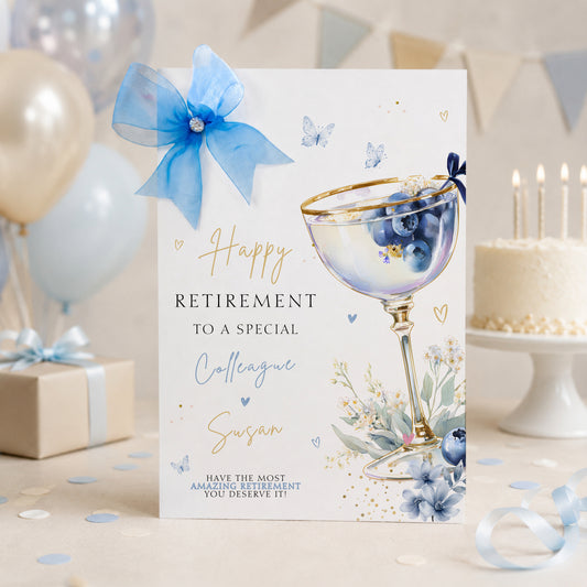 Luxury a4 large retirement card for a colleague, friend or any relationship, featuring a blueberry cocktail design hand finished with a gorgeous sparkle large organza bow and diamonte gem. This is a lovely luxury card that will stand out from the crowd.