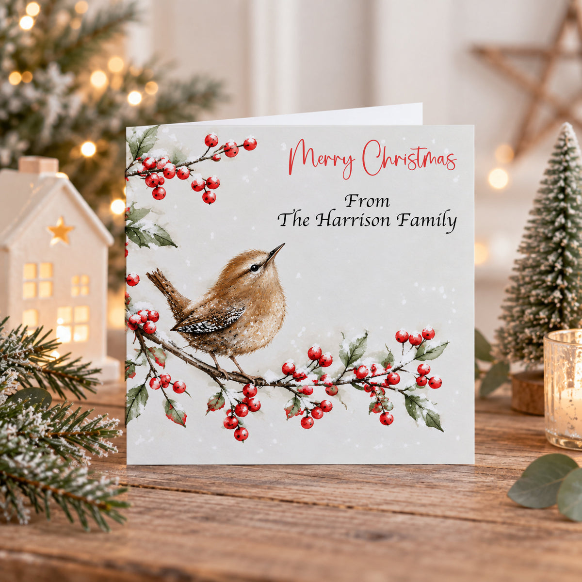 Personalised Christmas card pack featuring three different robin Christmas card designs with holly, red berries and snowy winter scenes.