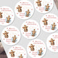 Multiple personalized Christmas stickers with a reindeer design and text on a white background.