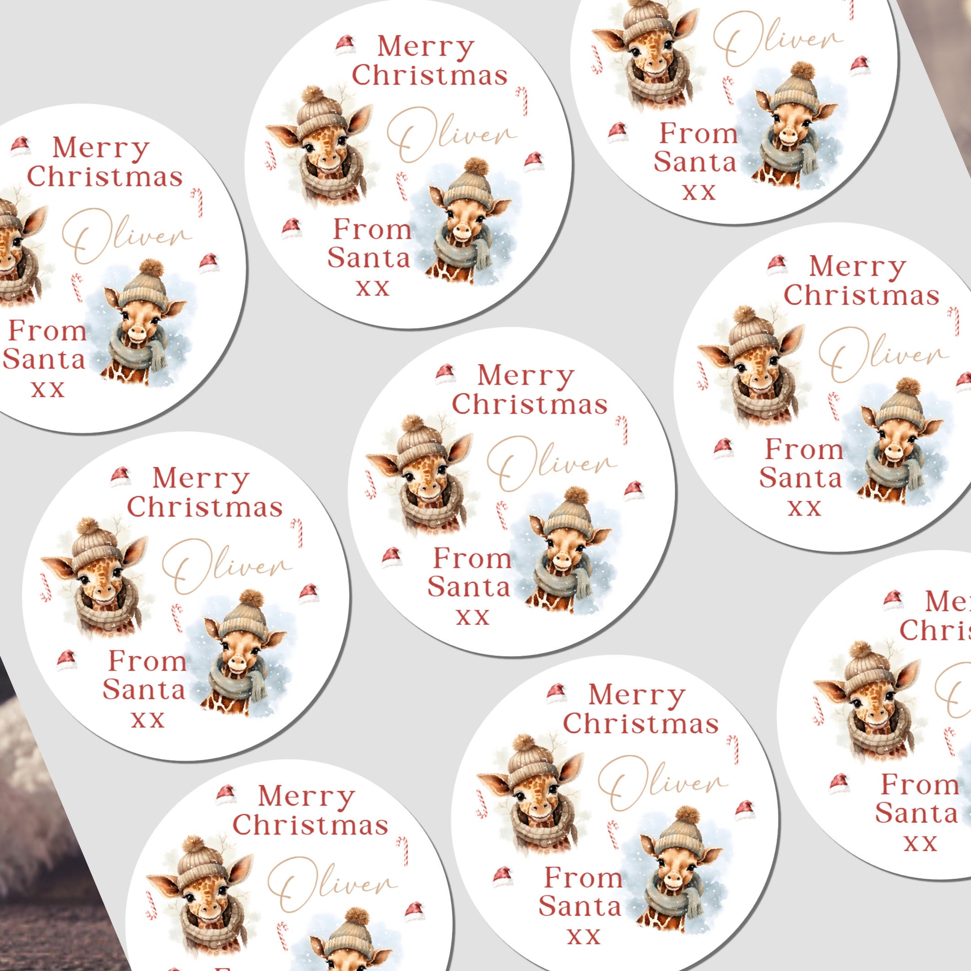 Multiple personalized Christmas stickers with a reindeer design and text on a white background.