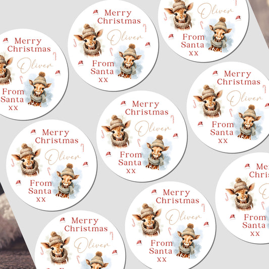 Multiple personalized Christmas stickers with a reindeer design and text on a white background.
