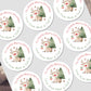 Circular Christmas stickers with reindeer and trees on a white background