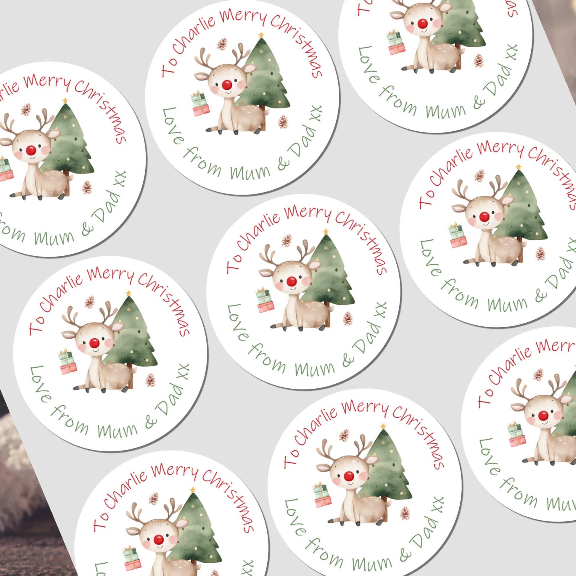 Circular Christmas stickers with reindeer and trees on a white background