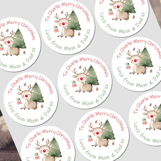 Circular Christmas stickers with reindeer and trees on a white background