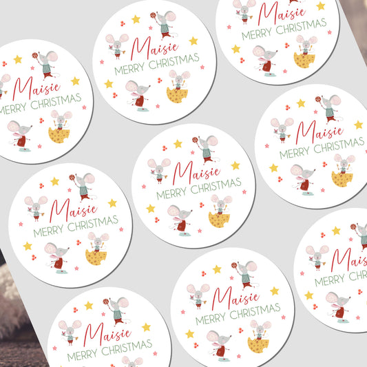 Circular Christmas stickers with cartoon mice design on a white background