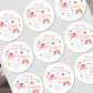 Personalized Christmas stickers with decorative elements and text on a white background.