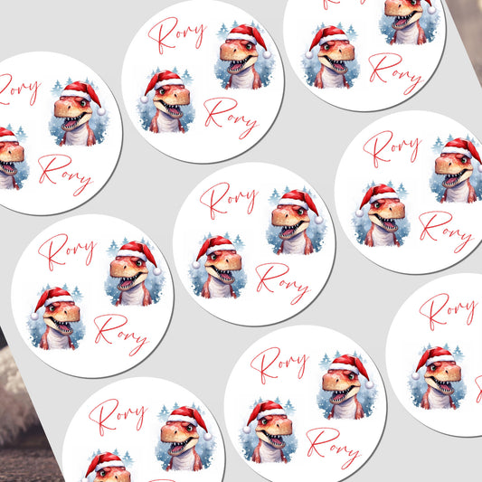 Stickers with a dinosaur wearing a Santa hat and the name 'Rory' on a white background.
