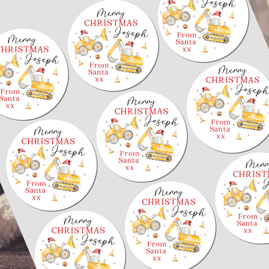 Circular Christmas labels with construction vehicle designs and personalized text on a white background.