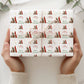 Personalised Christmas wrapping paper featuring Santa Claus, Christmas tree, large initial and name in red, green, gold and white festive design.