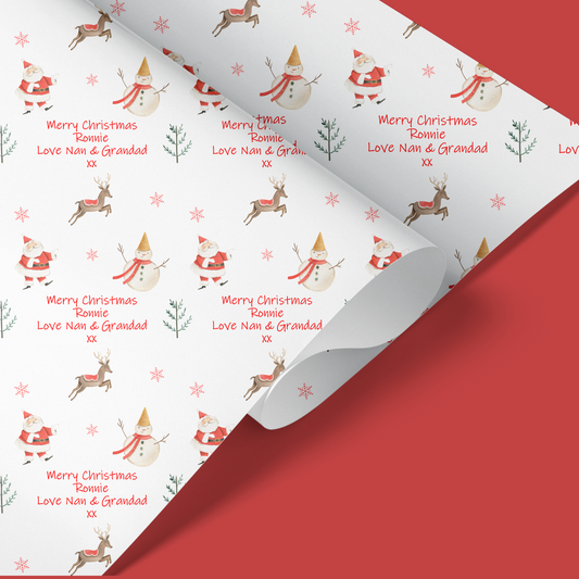 childrens christmas wrapping paper with santa snowman and reindeer pattern.