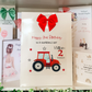 a birthday card with a tractor on it