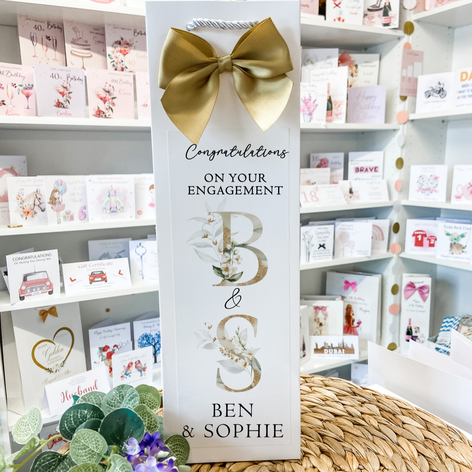 a card with a bow on top of a table