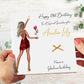 a person holding a birthday card with a picture of a woman