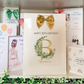 a birthday card with a gold bow on it