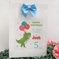 a birthday card with a dinosaur holding balloons