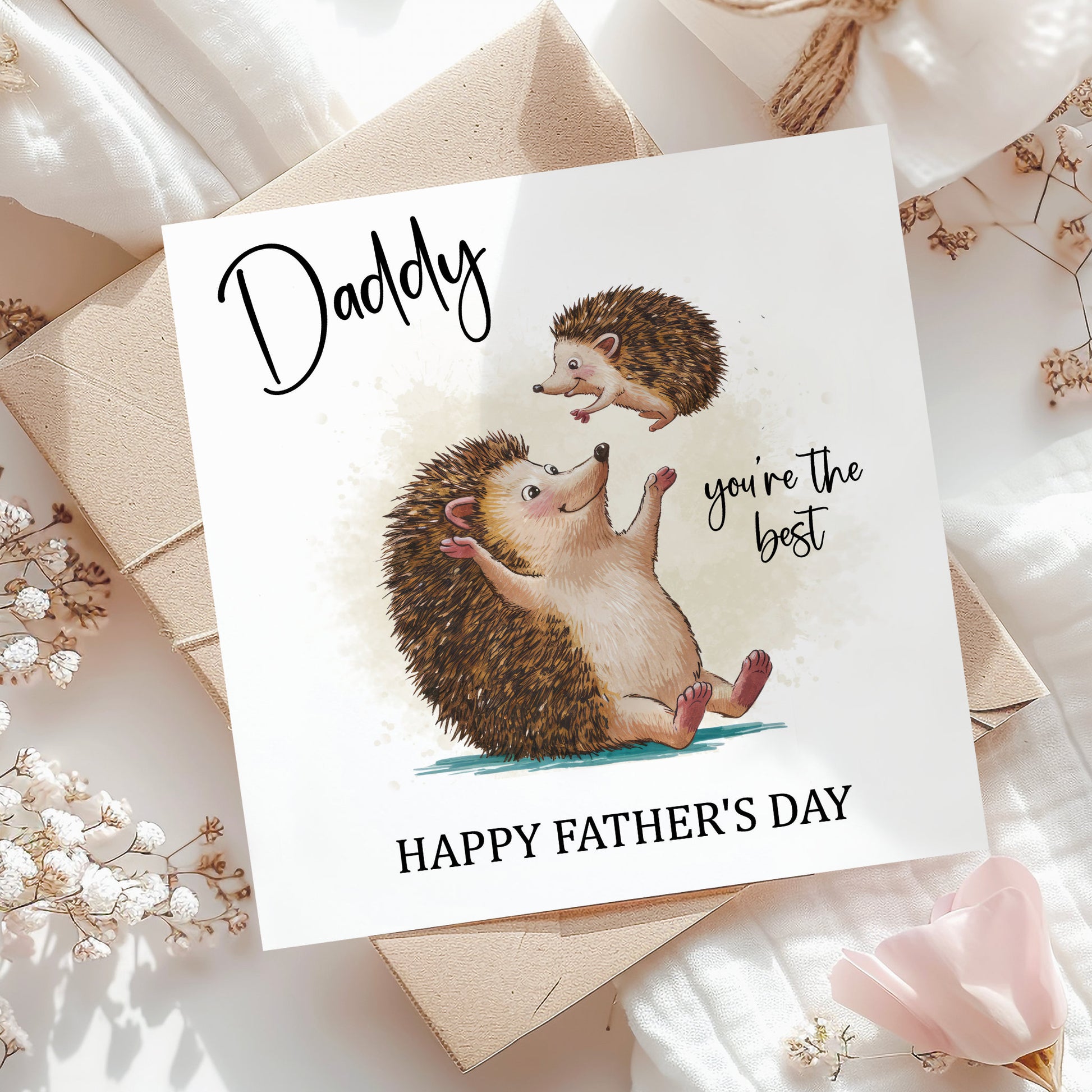 A greeting card with an illustration of a hedgehog and a baby hedgehog, along with the text "Daddy you're the best" and "Happy Father's Day".