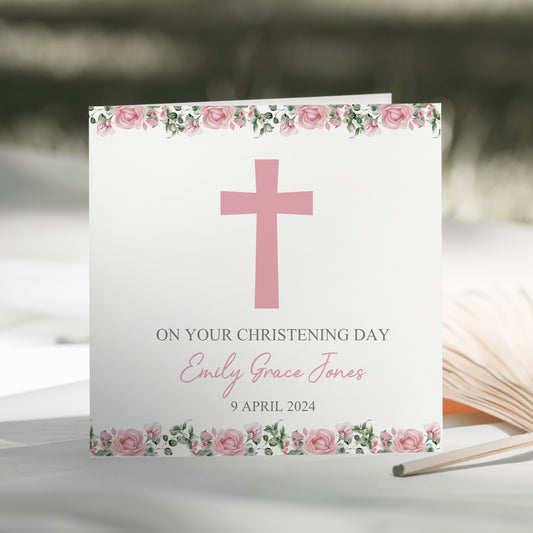 a card with a pink cross on it