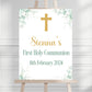 a white sign with a cross on it