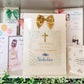 a card with a cross and a bow on it