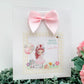 a card with a picture of a girl with a pink bow