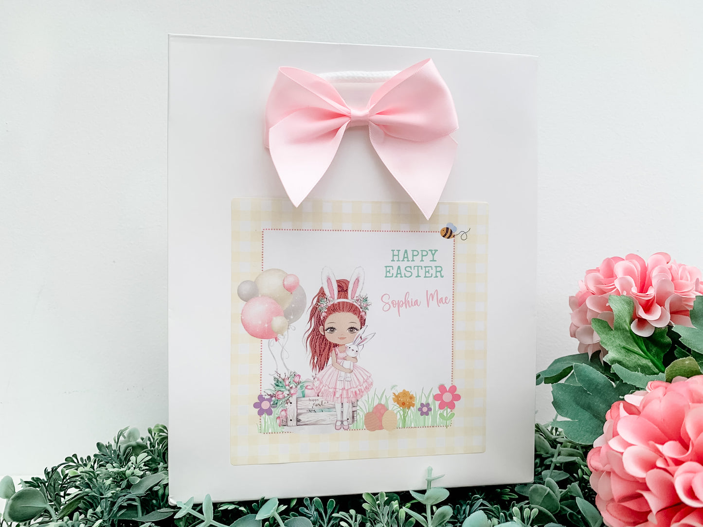 a card with a picture of a girl with a pink bow