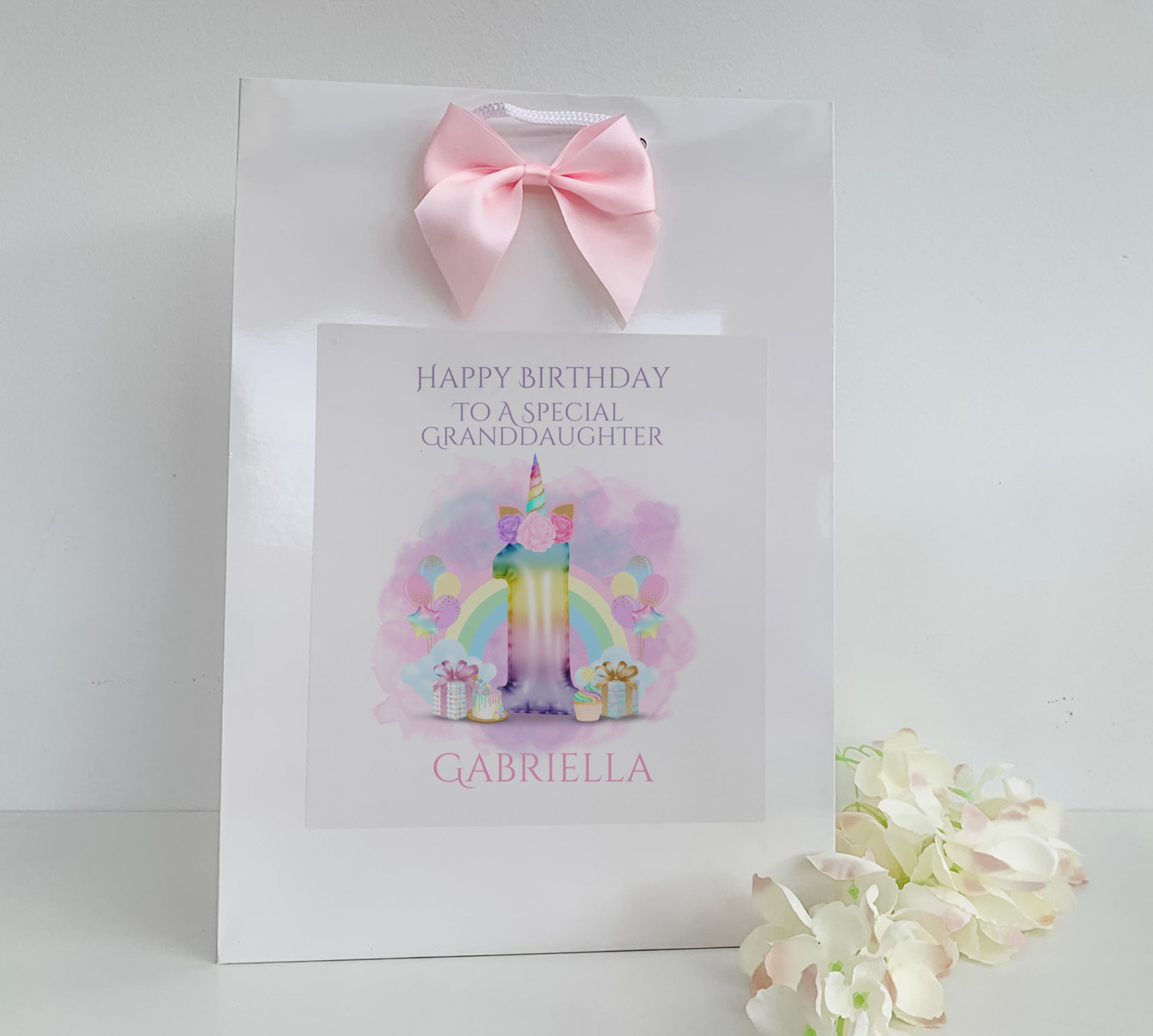 a birthday card with a pink bow on it