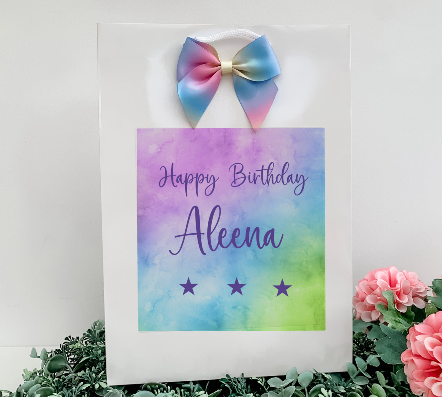 a birthday card with a bow on top of it