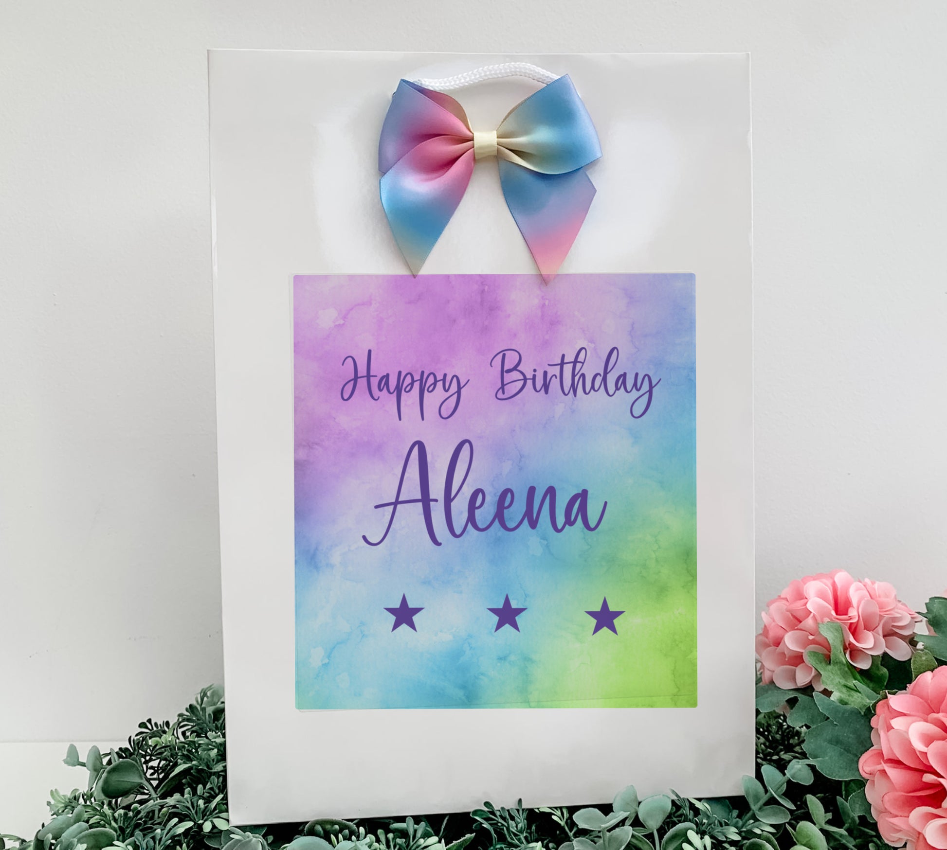 a birthday card with a bow on top of it