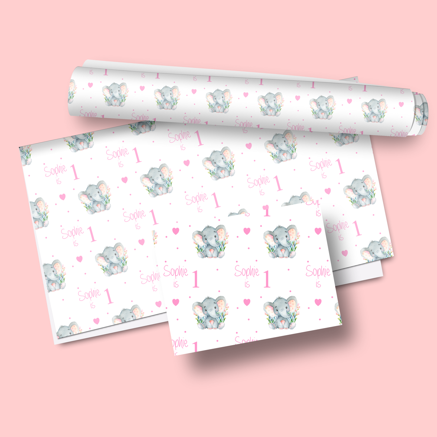 a roll of wrapping paper on a pink background