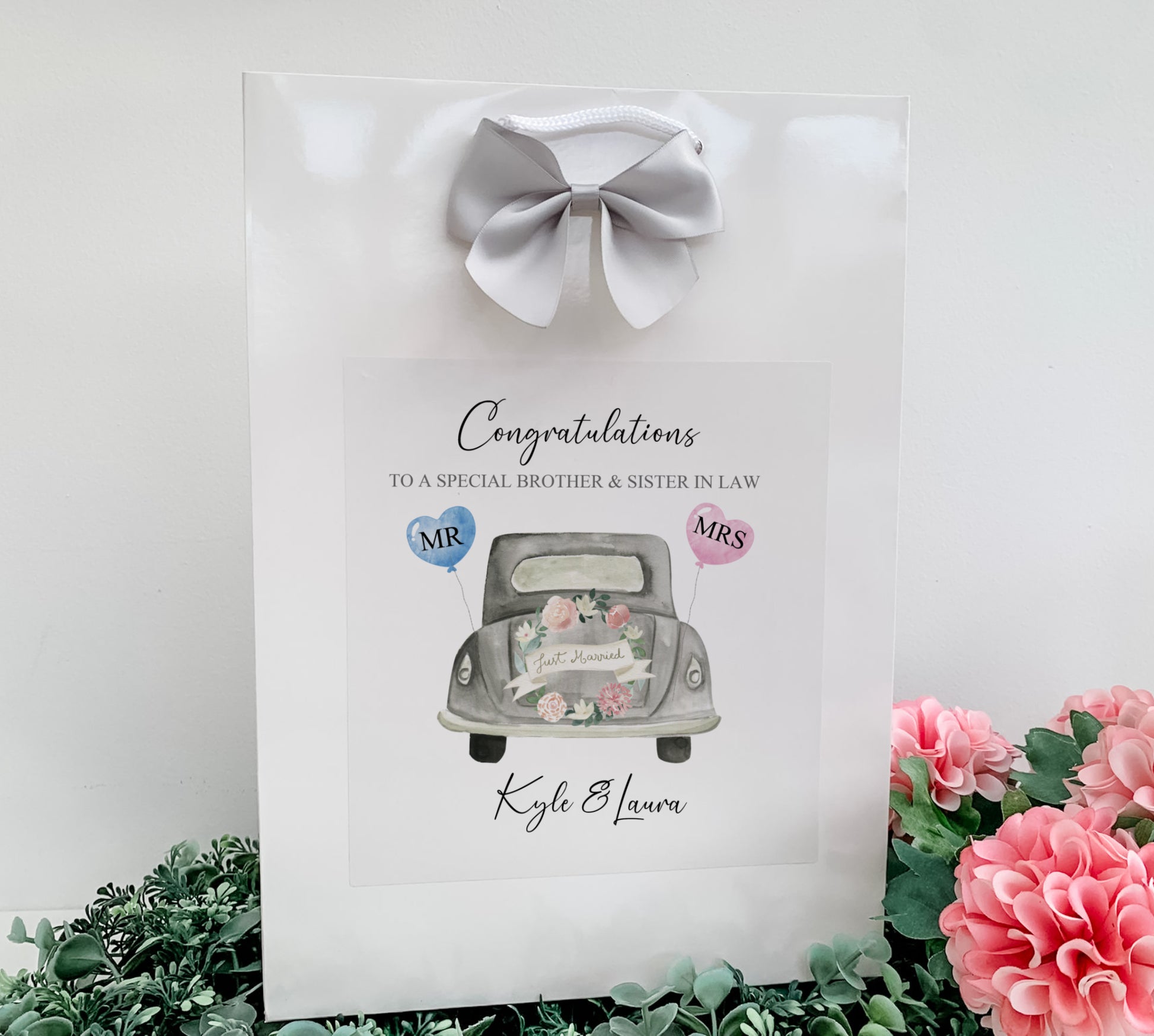 a card with a picture of a car and flowers