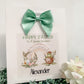 a happy easter card with a green bow