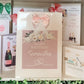 a birthday card with a pink bow on it