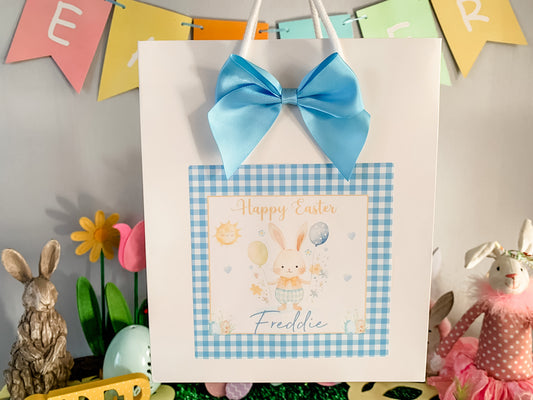 a happy easter card with a blue bow